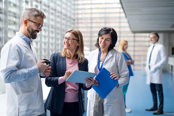 Medical professionals consulting together in a lobby