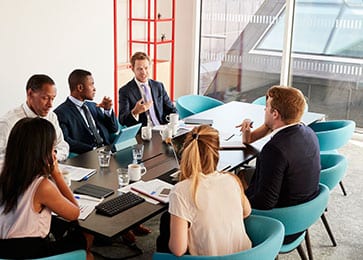 Professional business people working at conference desk