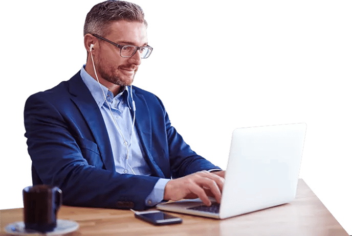 Professional writer at table working on laptop