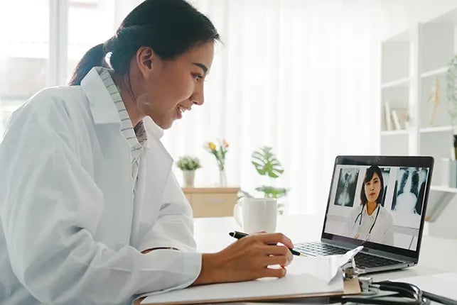 Two healthcare workers meeting virtually