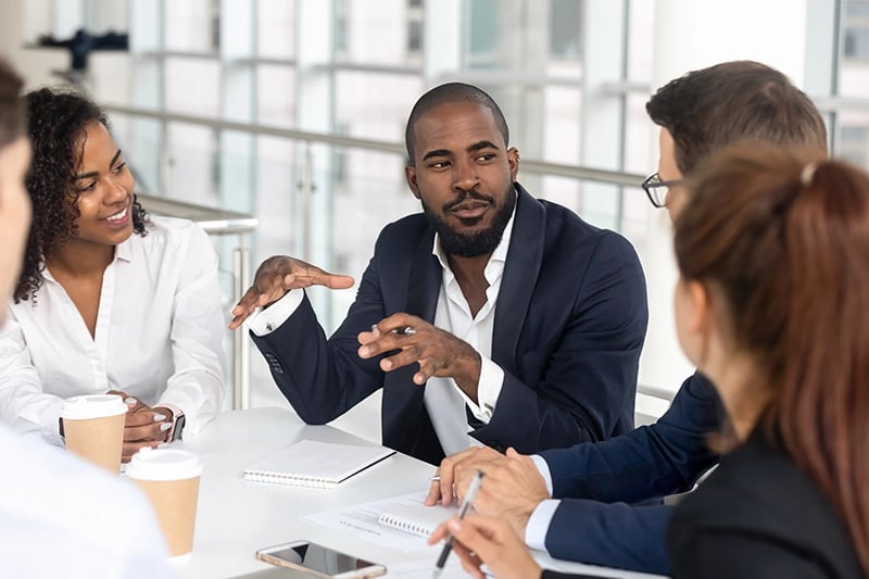 professionals-discussing-around-a-conference-table