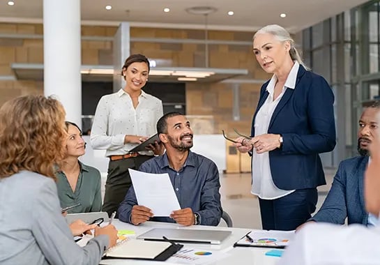 Diverse group of business professionals working together at a meeting