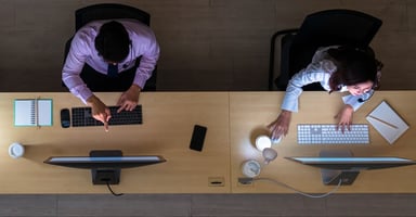 colleagues working at the computer in a contact center
