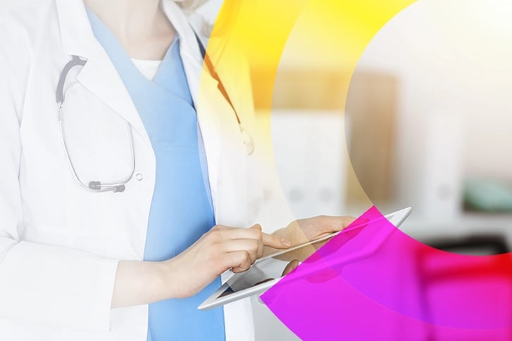 Woman using a tablet in a lab room.