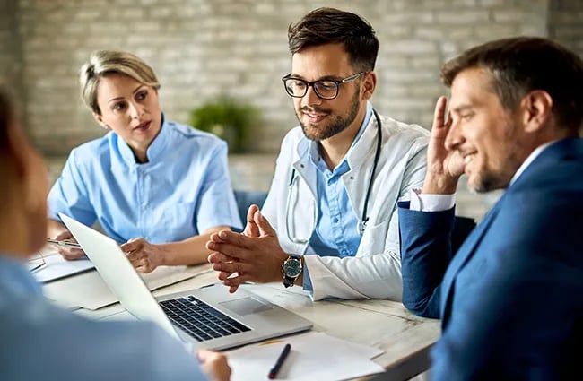 Medical professionals business professionals working at a conference table