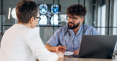 Healthcare professional discussing results with a patient