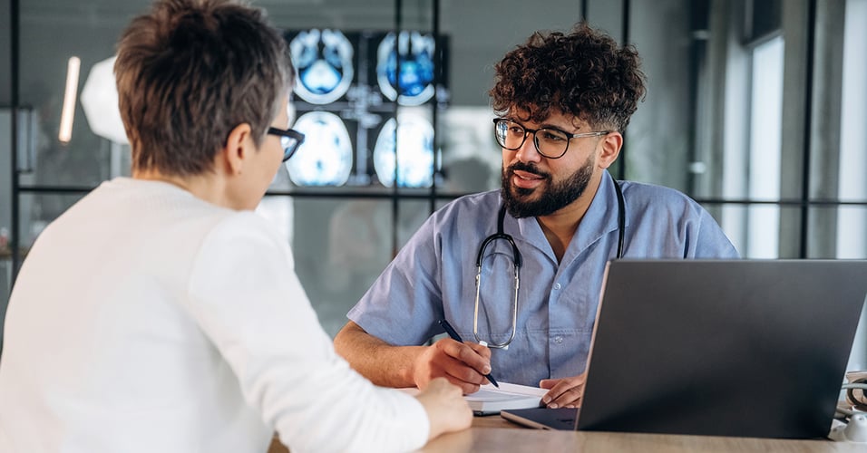 Healthcare professional discussing results with a patient