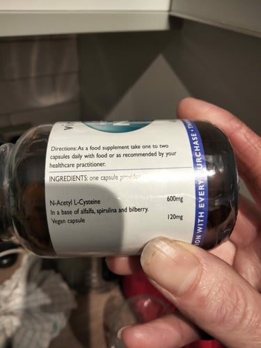Close-up of a supplement bottle with N-acetyl-L-cysteine as an ingredient.