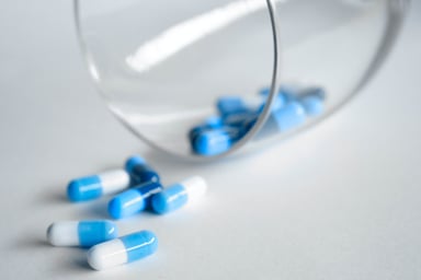 Blue Pills in a glass