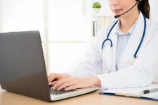 Medcial professional using laptop