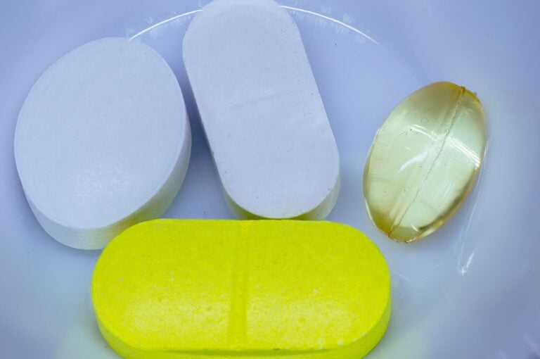 Several pills sitting on a table.