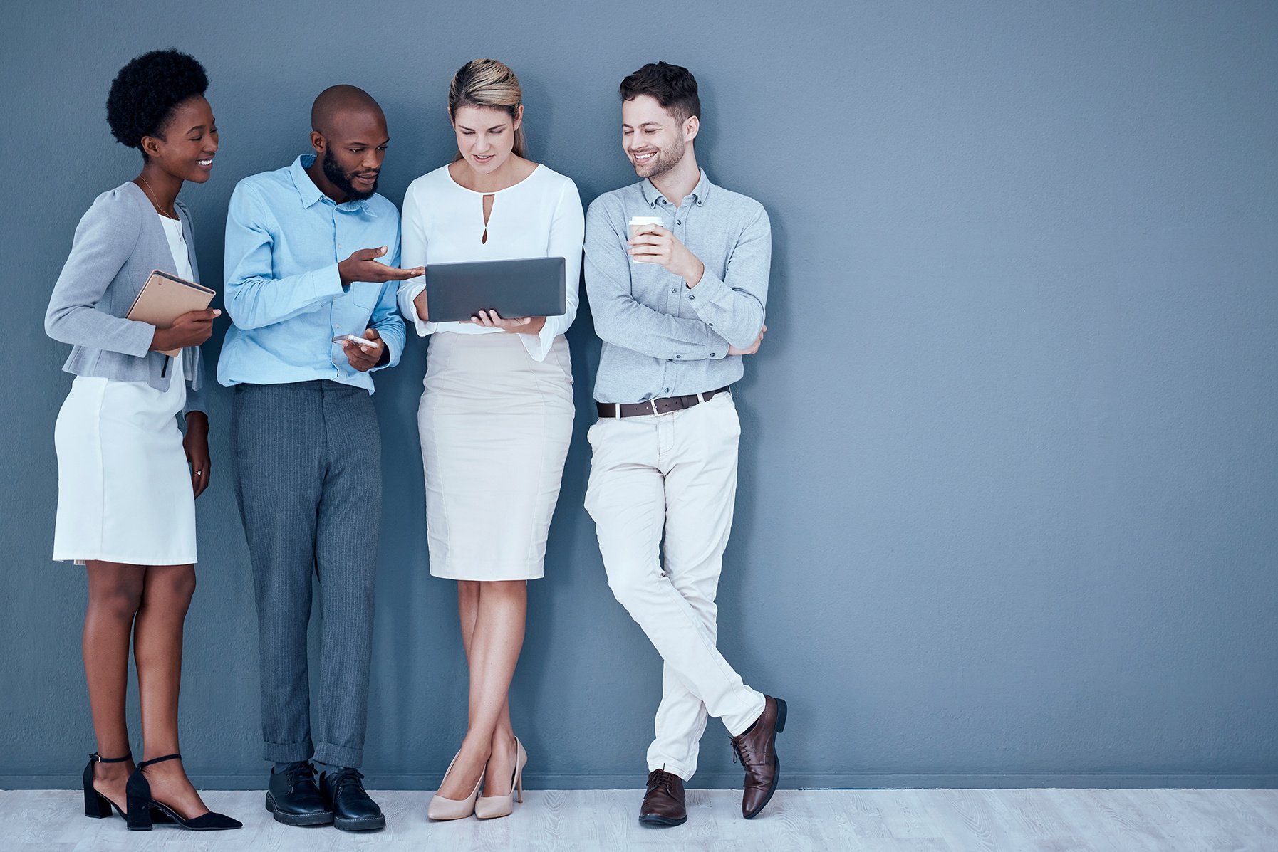 coworkers-leaning-on-wall-as-594553819
