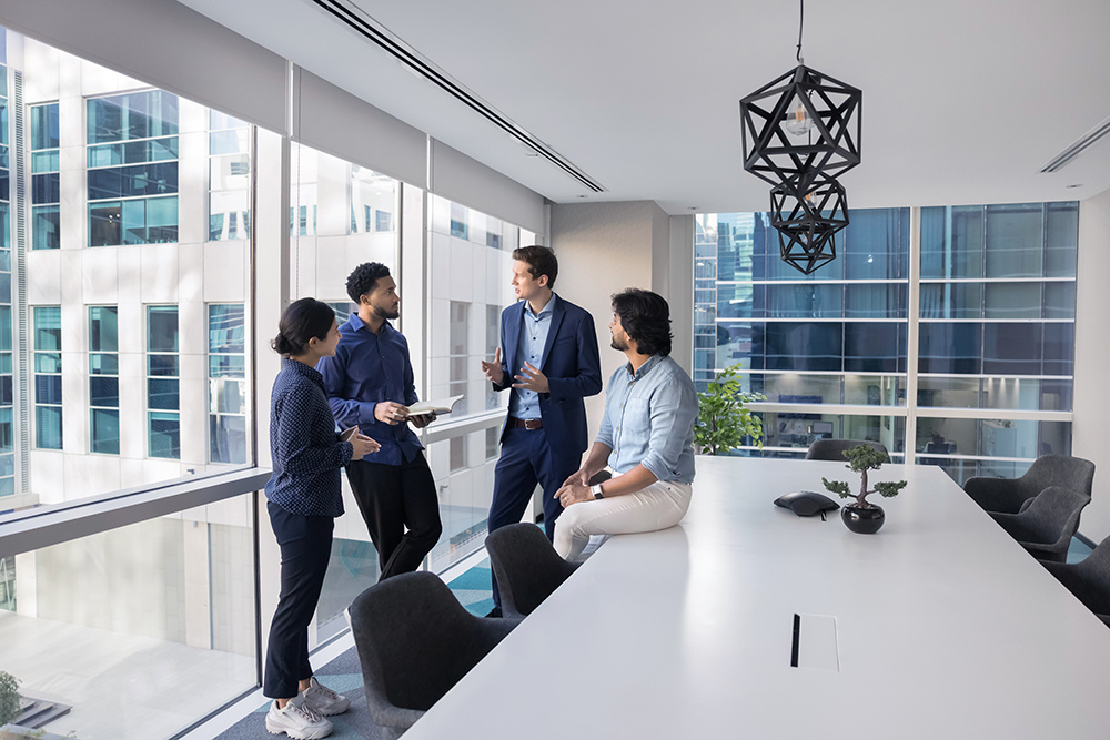 Casually dressed business professionals talking in an conference room
