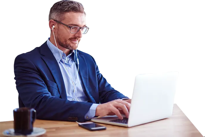 Professional writer at table working on laptop