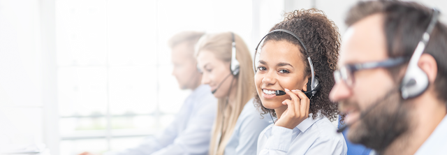 Woman smiling while wearing a headset