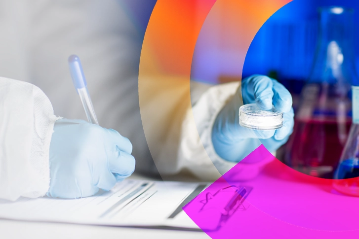 Gloved hands writing on clipboard and holding a petri dish